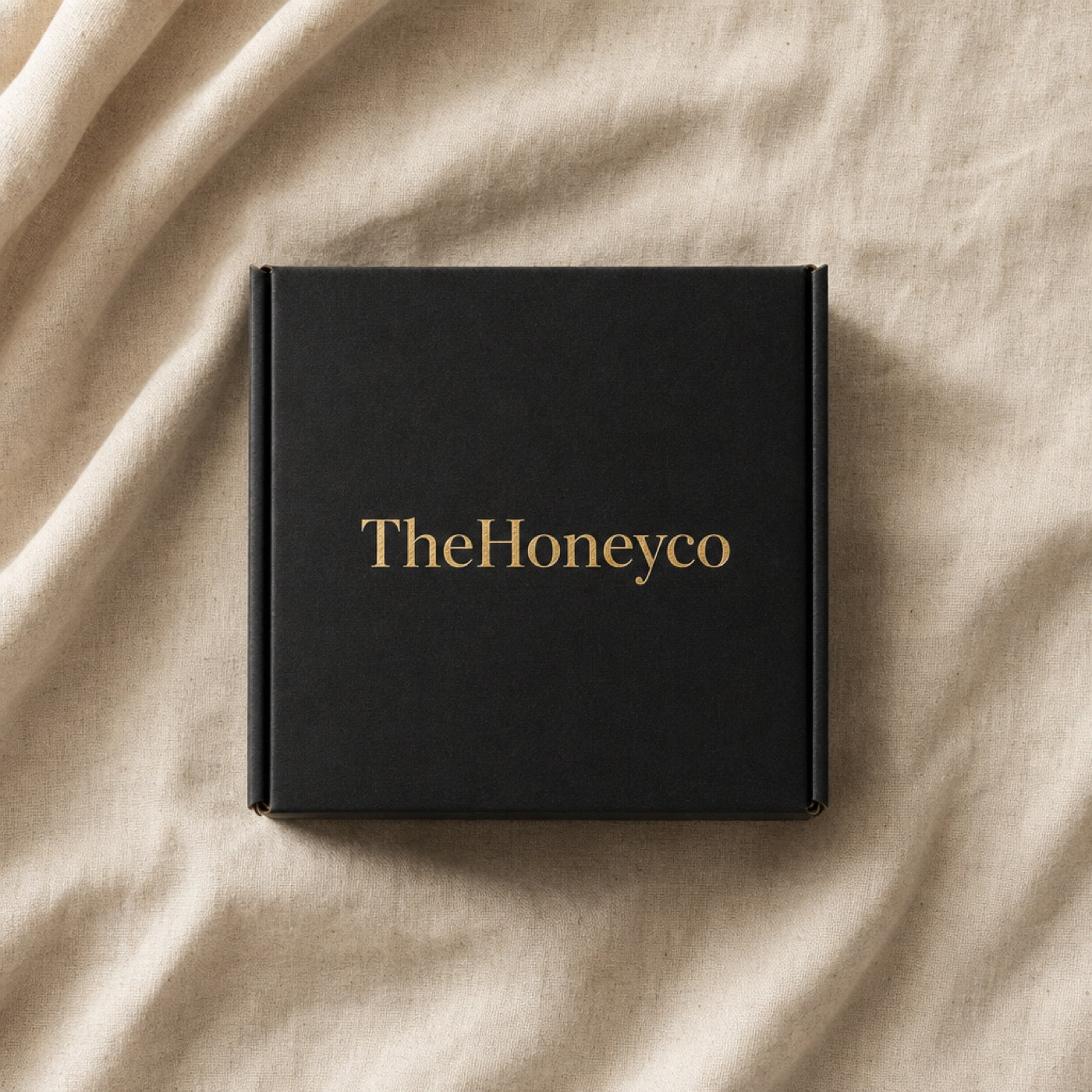 TheHoneyCo box, closed, on linen