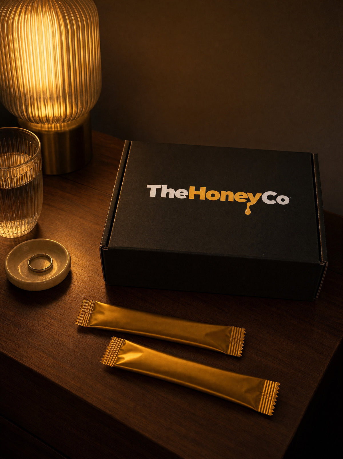 TheHoneyCo honey pack on a bedside table